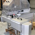 Ensemble Dégrilleur courbe compacteur installé en canal inox préfabriqué avec bypass équipé d'une grille manuelle de secours - STEP de BUZET - en attente d'expédition