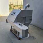 Ensemble tamis rotatif-compacteur DM-TRCV destiné à être installé sur la STEP de Labastide d'Ajou (11) , en attente de livraison